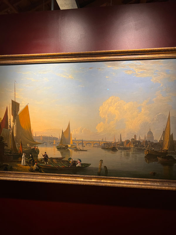 A painting of a harbor with boats in a frame