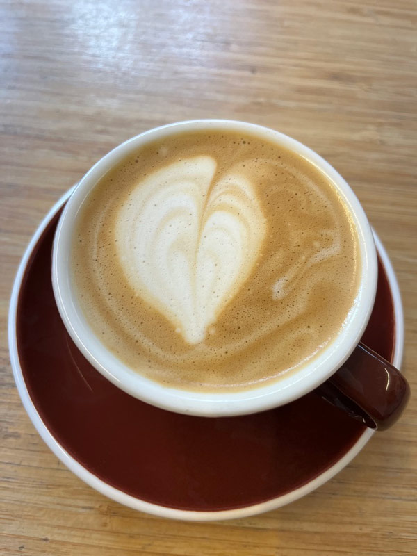 a cappuccino cup with a foam heart