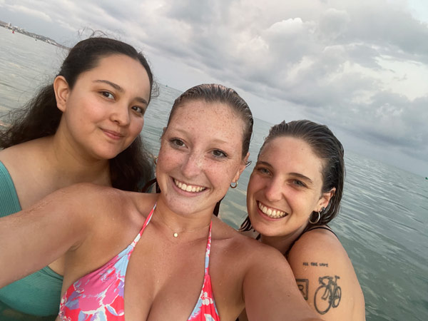 study abroad roommates taking a selfie in water