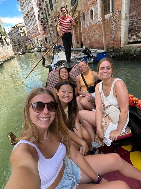 A group of study abroad students on a boat