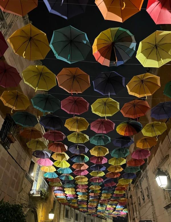 A group of umbrellas from a ceiling