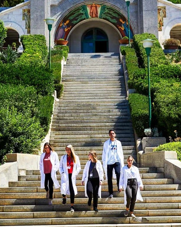 Students walking down large staircase