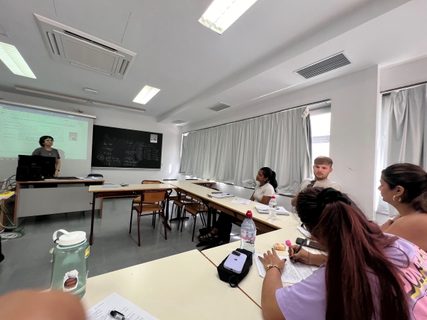 Classroom setting with study abroad students and professor
