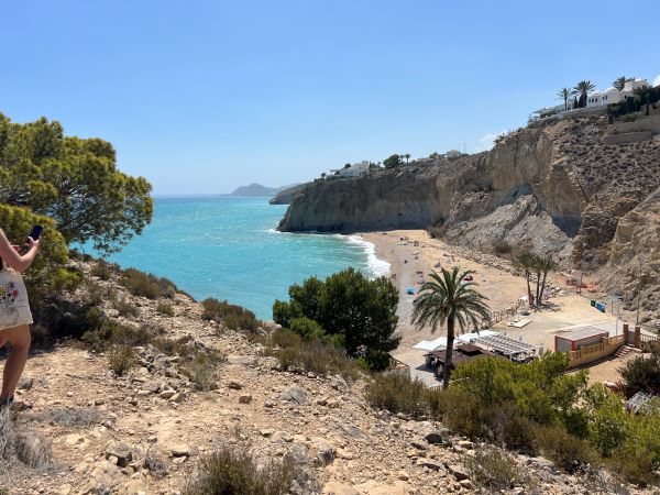 View of secluded Alicante beach with bright blue water