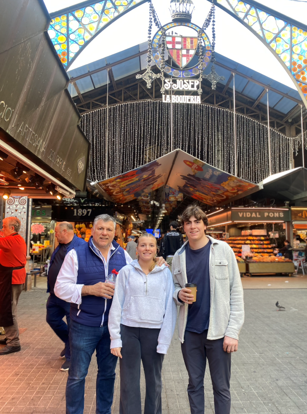 Study abroad student posing for photo with dad and sister