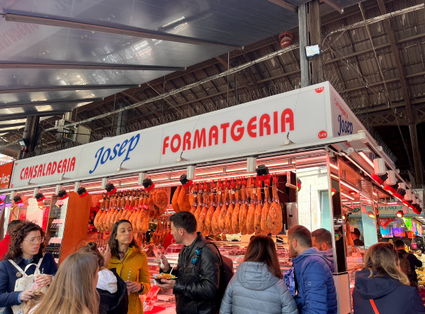 Photo of pig legs on display at market