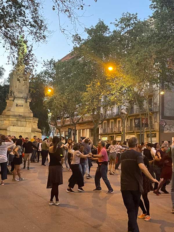 A group of people dancing in a city