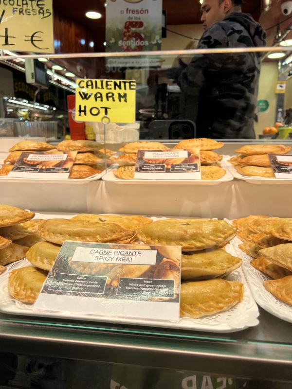 Variety of empanadas on display in window