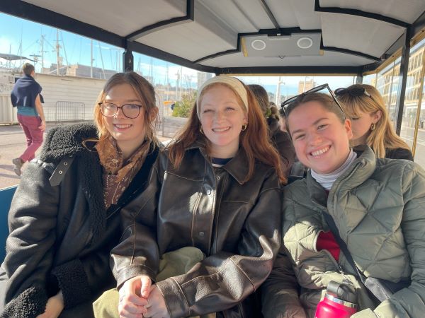 Three study abroad students on train 