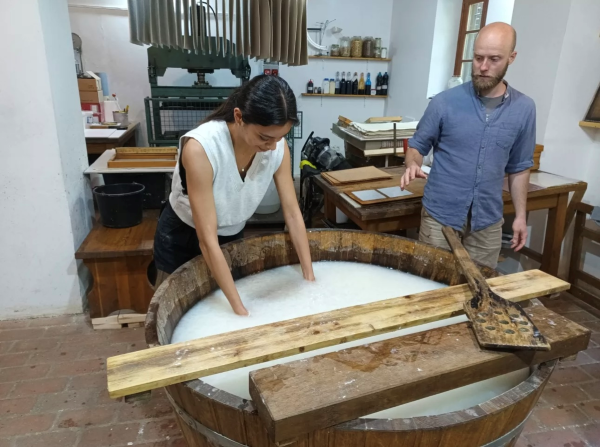 A study abroad students making handmade paper