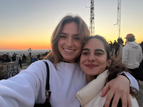 Selfie of two study abroad students during sunset