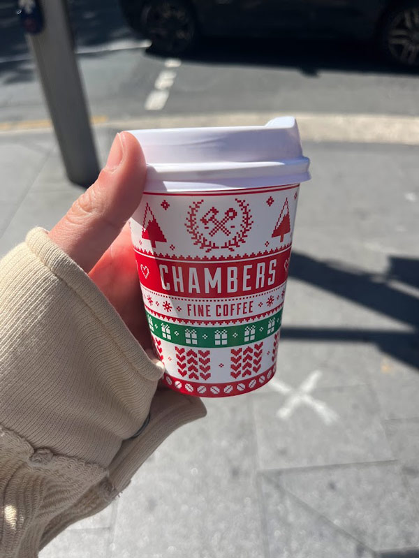 a Christmas themed coffee cup