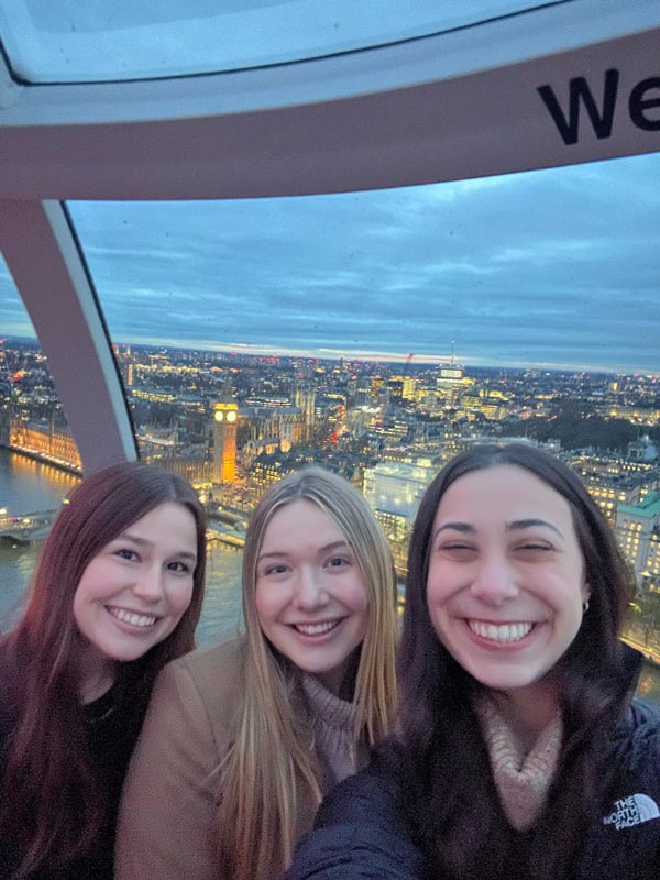 Study abroad students taking a selfie inside the London eye at sun down