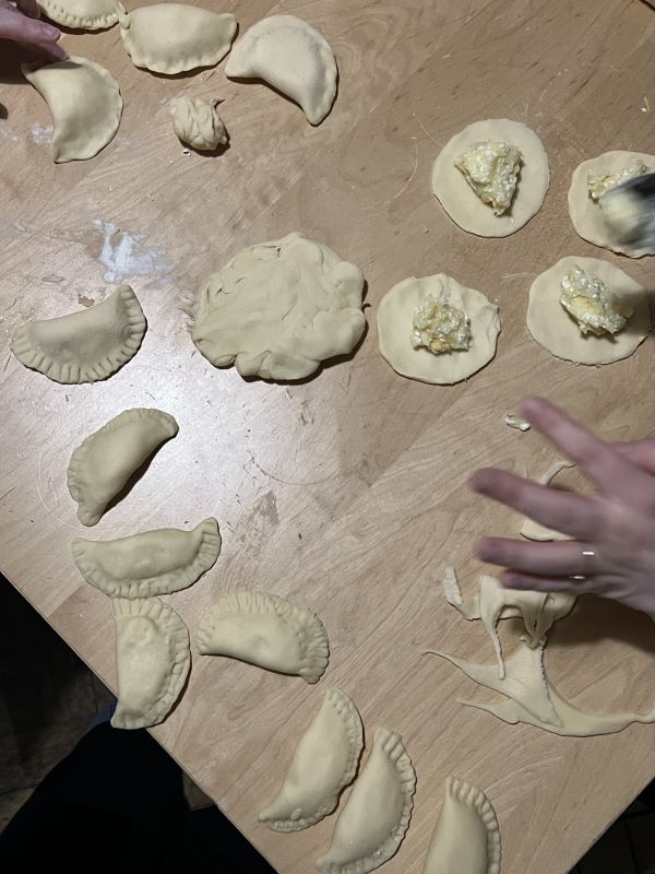 Photo of study abroad students making homemade pierogi
