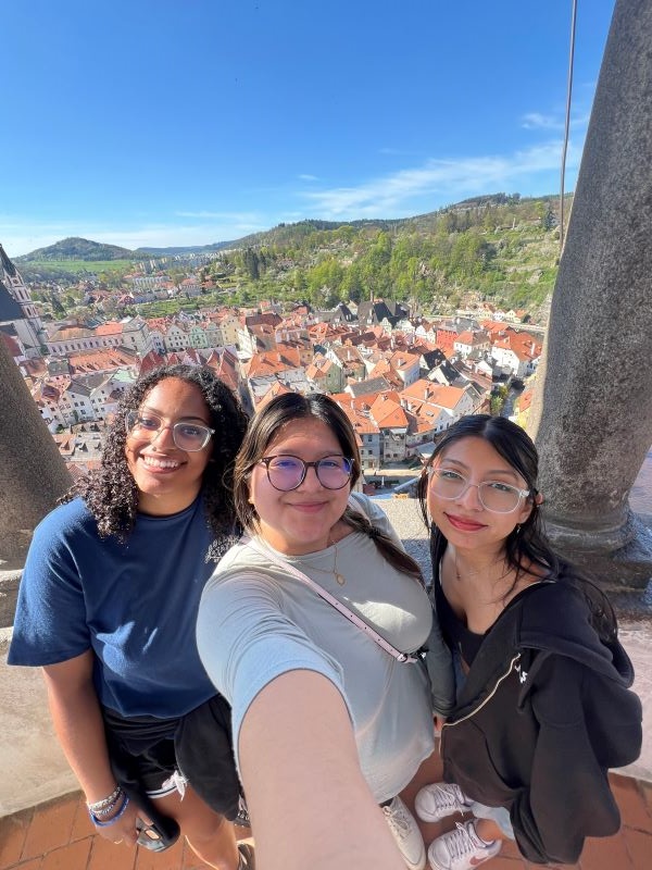Selfie of 3 study abroad students with Cesky Krumlov in background