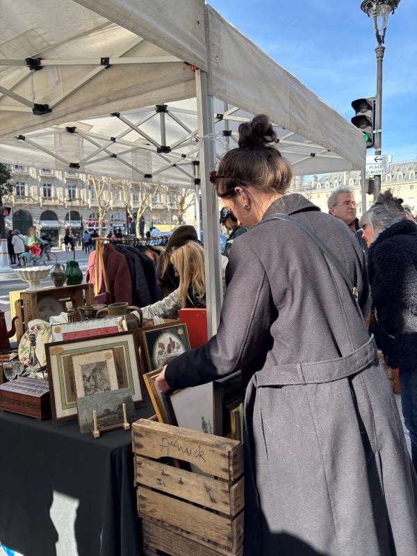 Study abroad student looking through vintage frames