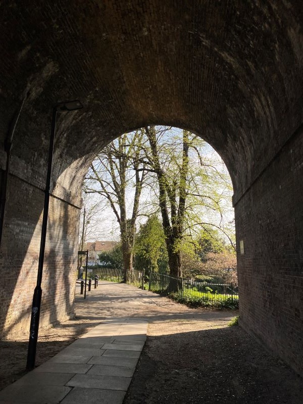 Bricked tunnel in lush London Park
