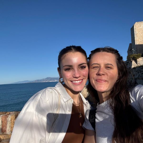 Selfie of study abroad student with cousin with ocean in background
