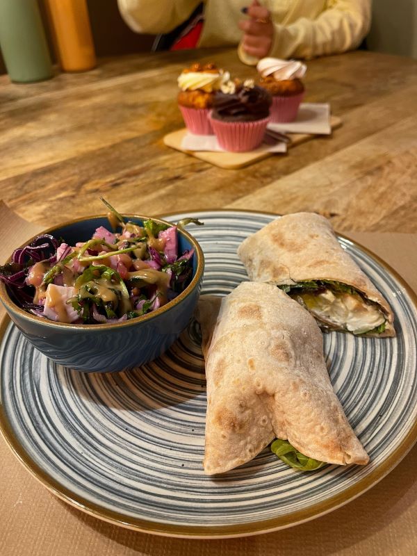 Plated breakfast wrap with side salad