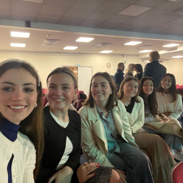 Selfie of five study abroad students sitting at church