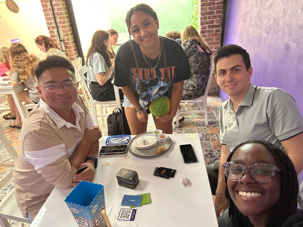 A group of study abroad students sitting at a table
