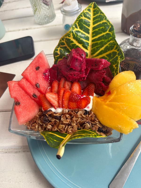 A bowl of fruit on a plate