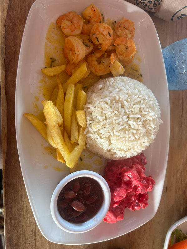 A plate of food with shrimp and fries