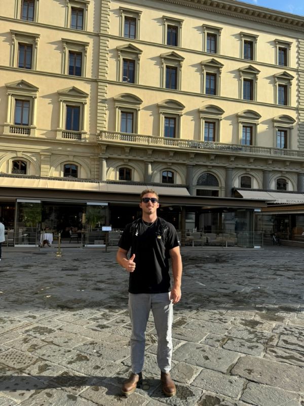Study abroad student posing for photo on street