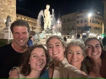Selfie of study abroad student with other community members