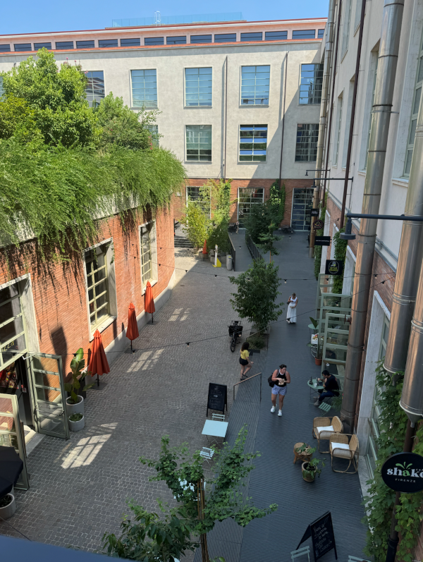Image of small street with restaurants and civilians