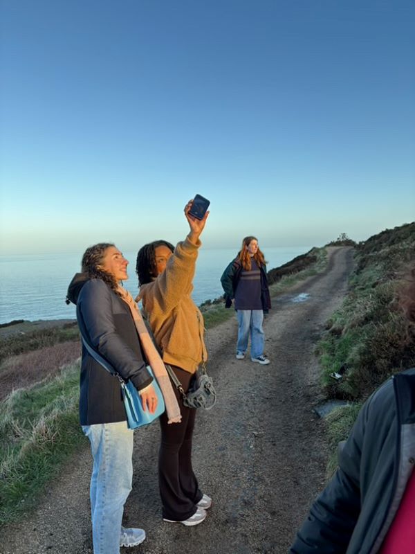 Study abroad students taking selfie along Irish coast