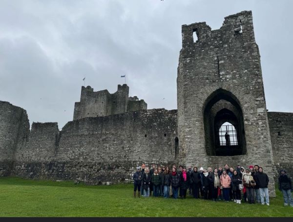 Image of study abroad students gathered for photo in front of Trim Castle