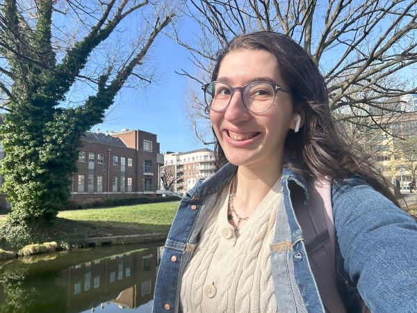 Selfie of study abroad student walking to class next to canal