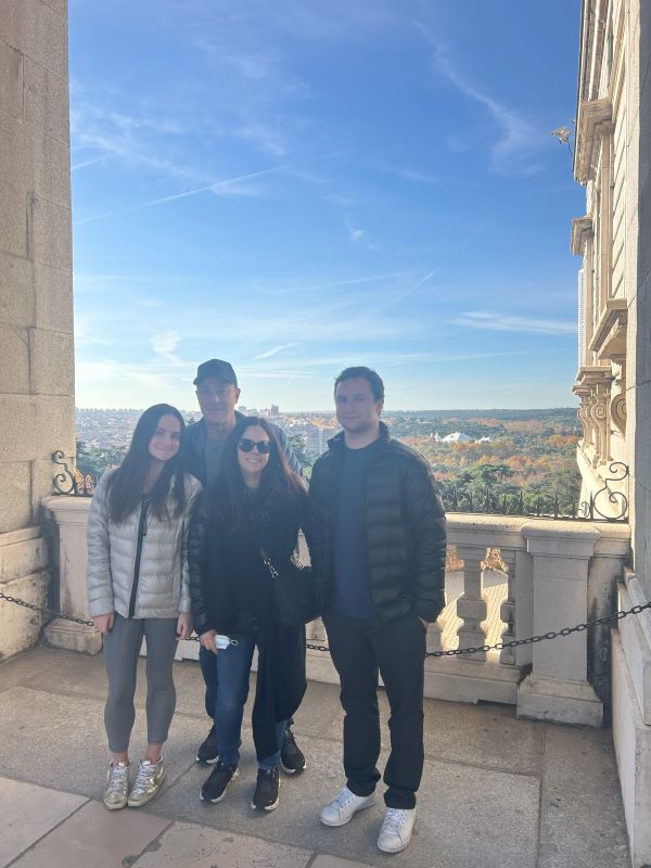 Study abroad student posing for photo in front of view of city