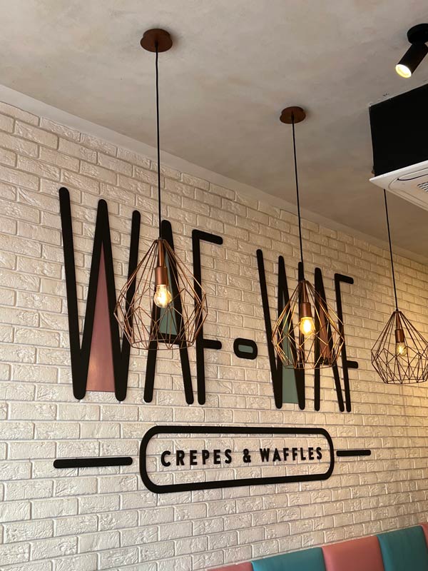 Interior photo of Waf Waf, a crepe and waffle restaurant in Prague.