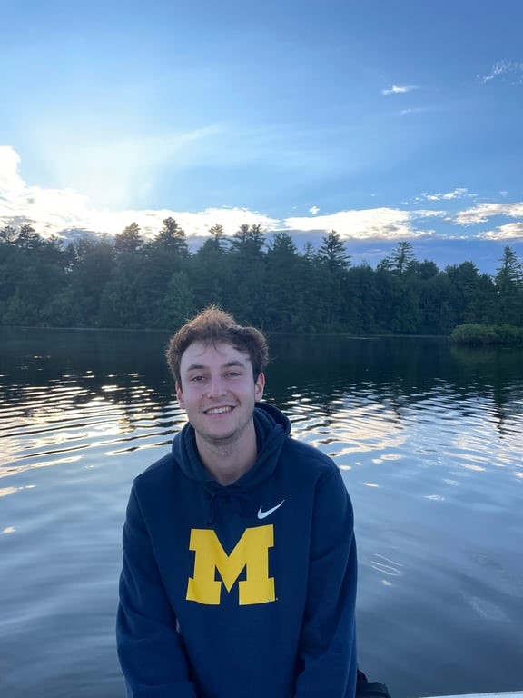 A person smiling on a body of water