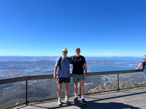 Two study abroad students posing for photon on Mt. Wellington