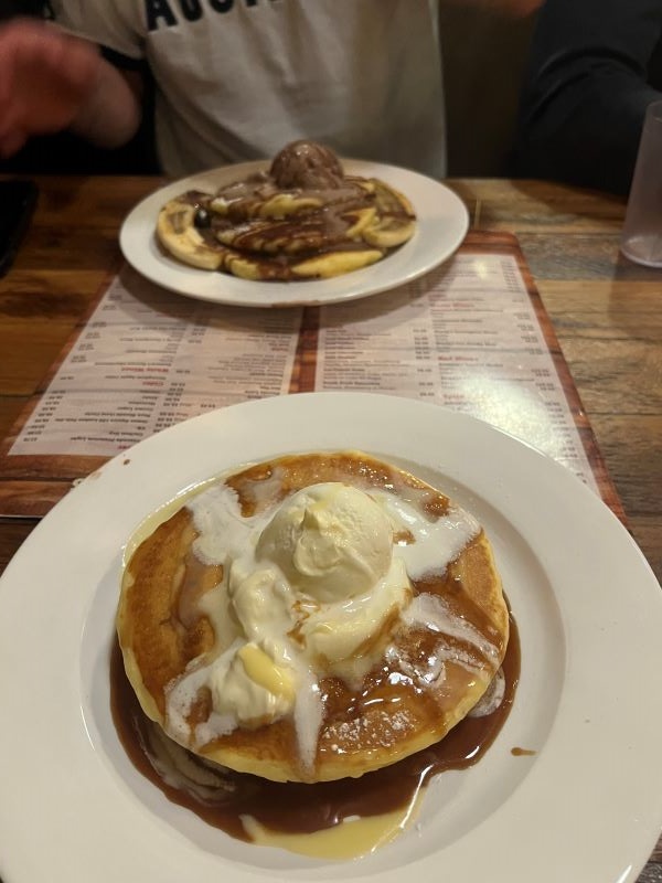 Plated pancakes with scoop of ice cream on top