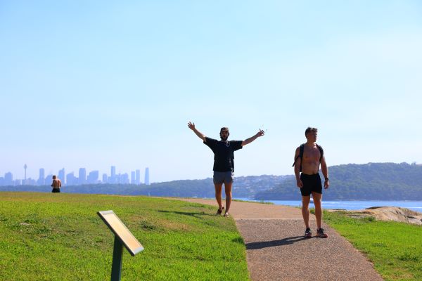 Study abroad student posing for photo on paved walk