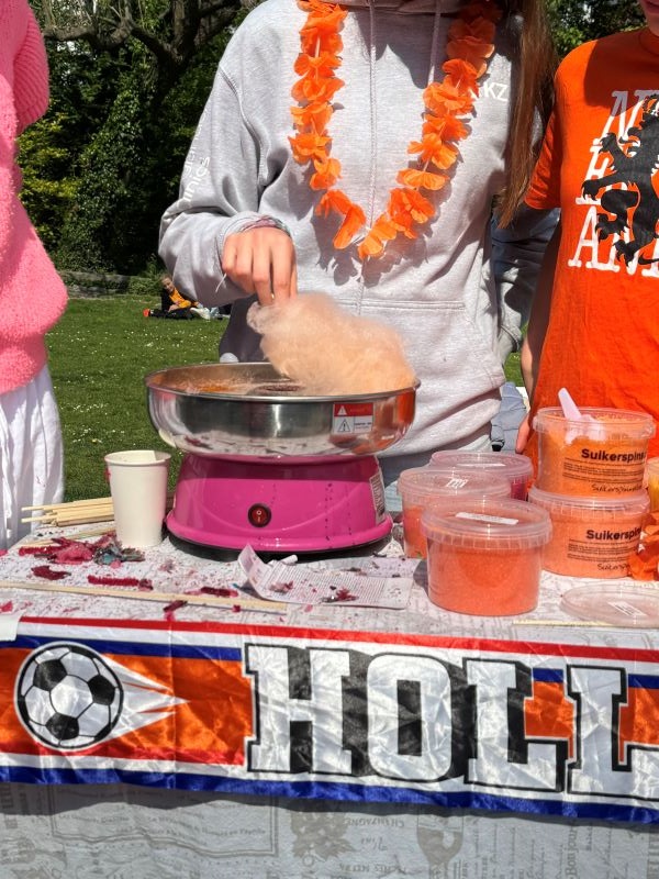 Vendor making cotton candy 