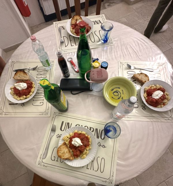 Photo of table with four plated pasta dishes