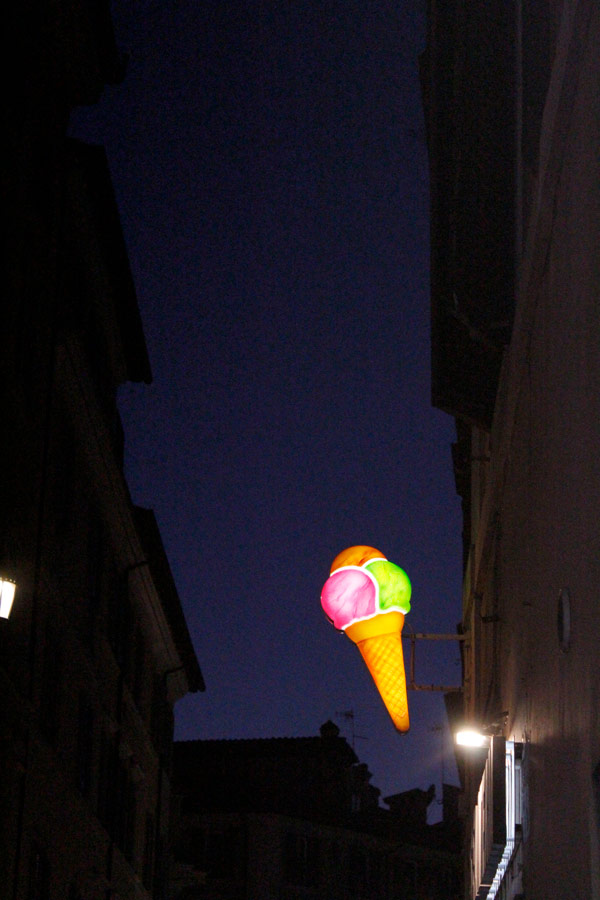 A large ice cream cone sign
