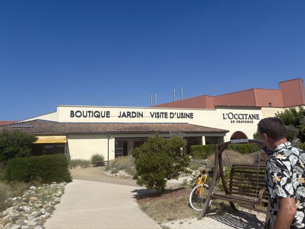 A one-story building with a cream-colored facade featuring the words