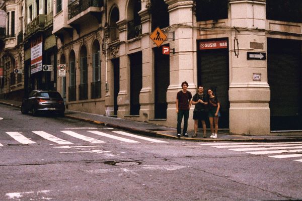 Film photo of three study abroad students standing on sidewalk