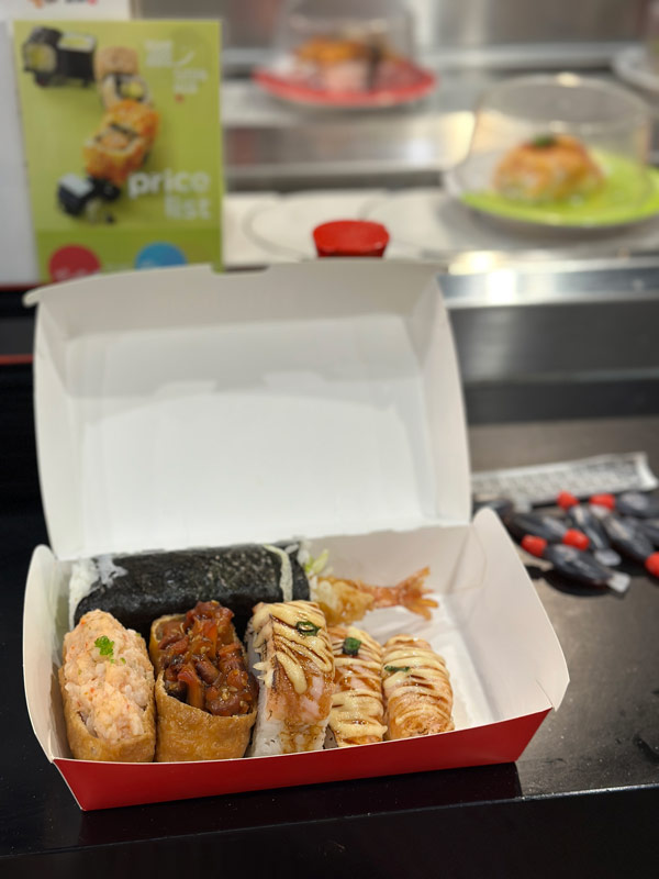 A box of sushi on a counter