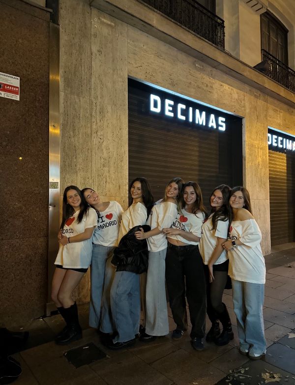 Group of study abroad students posing for photo in matching shirts