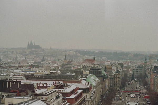 A city with many buildings and snow