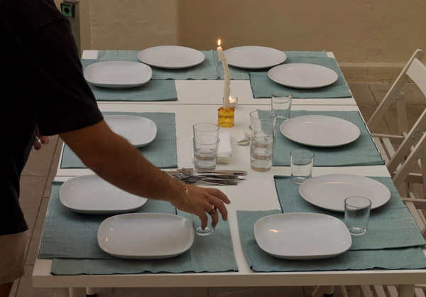 a person setting a table