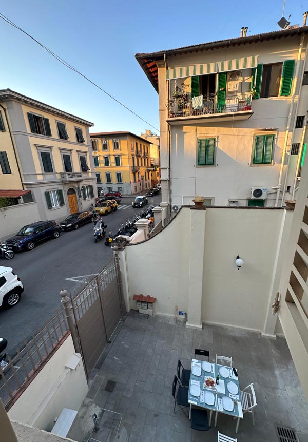 Balcony view of Italian street and courtyard 