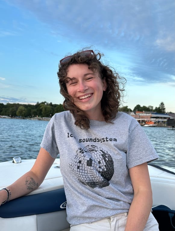 person smiling on a boat